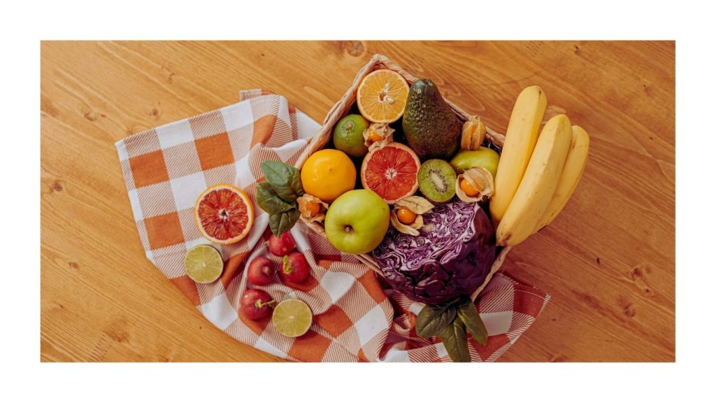 Assorted fresh fruits on wooden table | বিভিন্ন রকম তাজা ফল কাঠের টেবিলে